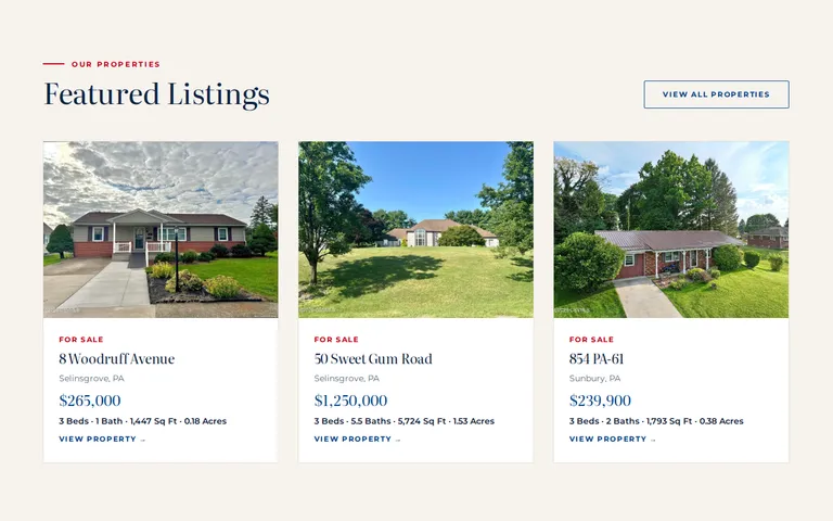The Featured Listings section, with cards for 8 Woodruff Avenue, 50 Sweet Gum Road and 854 PA-61. Each card has a photograph, a For Sale tag, the town, the price and the bedroom, bathroom, square footage and acreage figures.